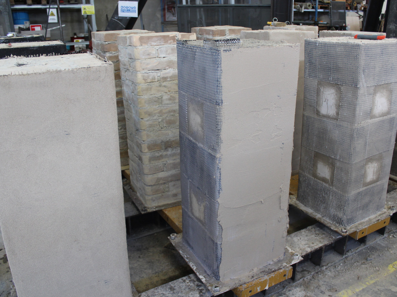 Masonry panel reinforced with FRP and FRCM.
